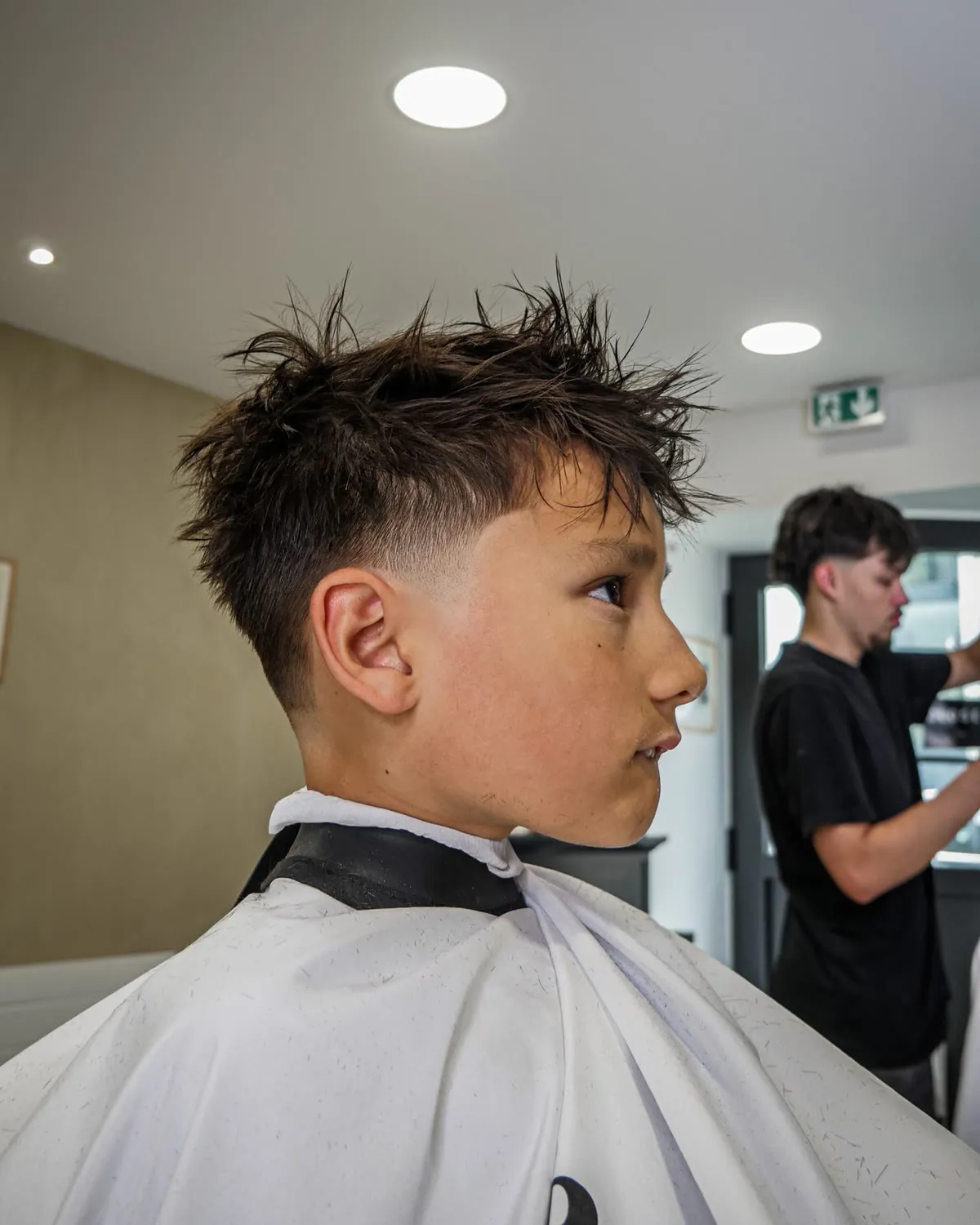 Dégradé sur un jeune client — Les Barbiers Bretons